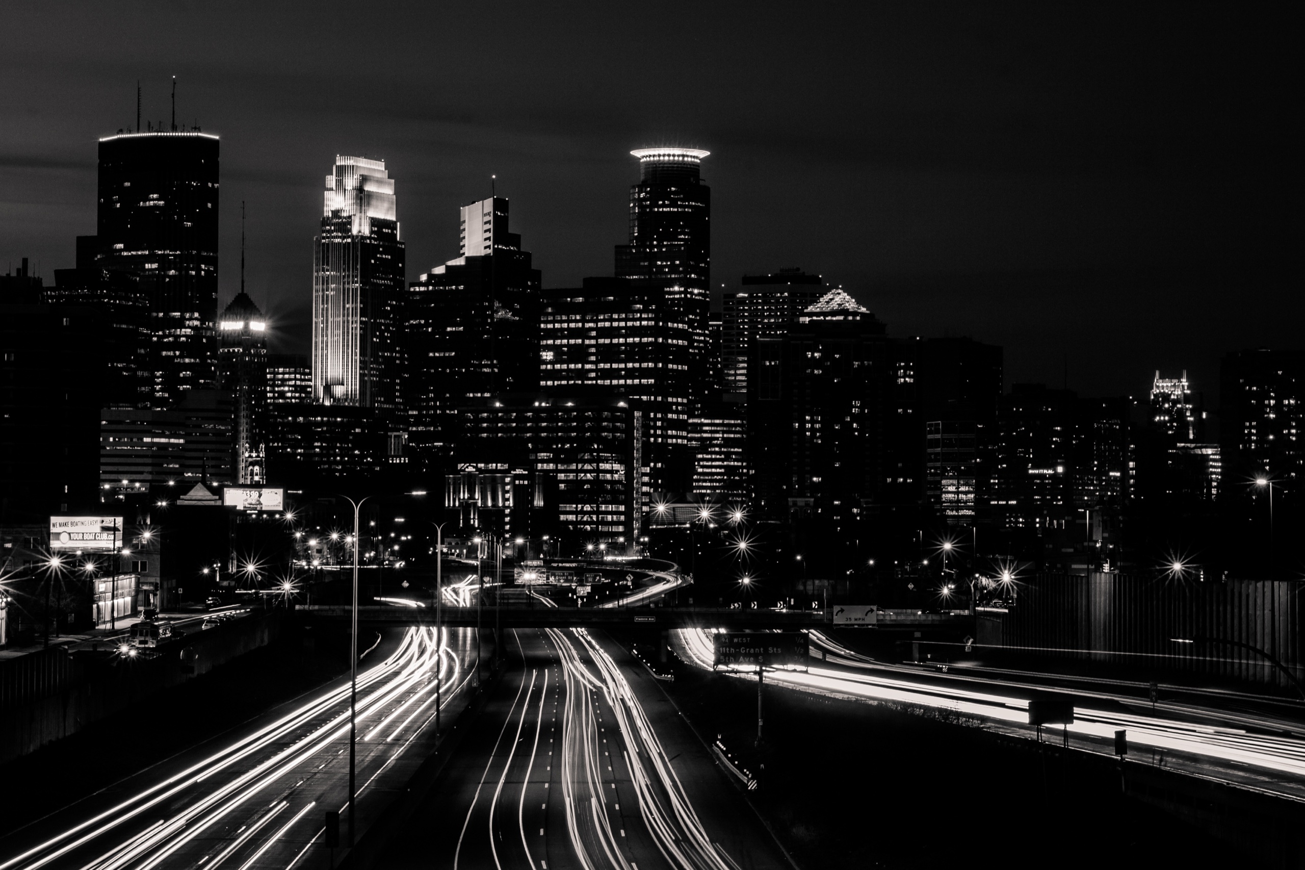 Minneapolis highway at night with city lights